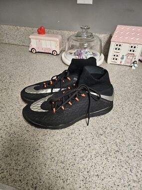 Nike Black Kids Indoor Soccer Shoes with Silver Swoosh and Orange Lace Tabs